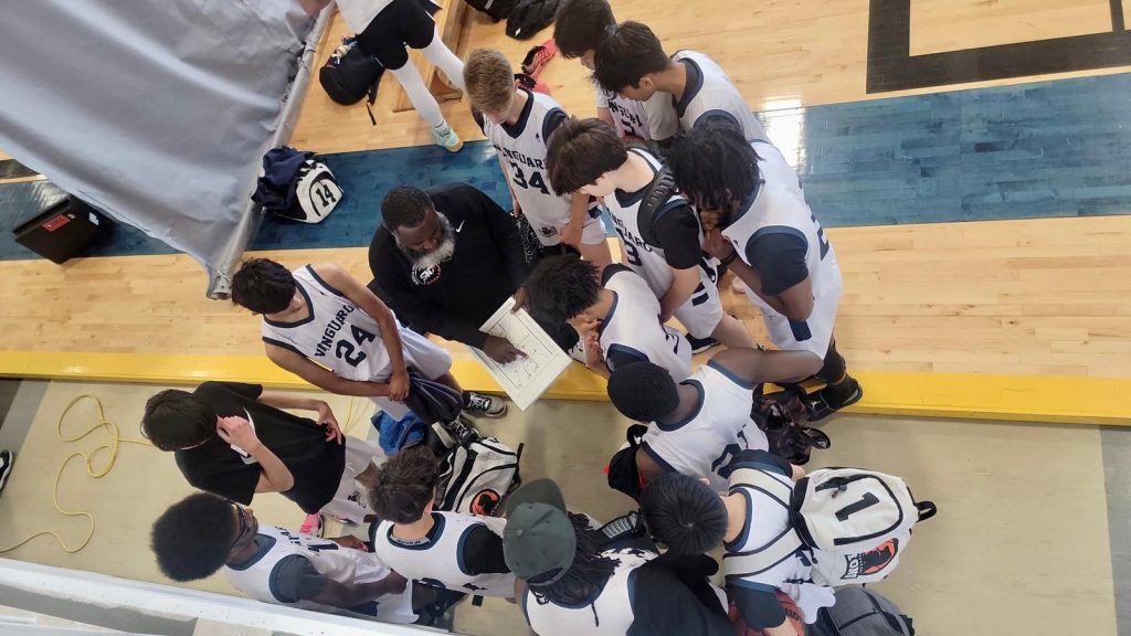 vanguard north basketball team in a huddle